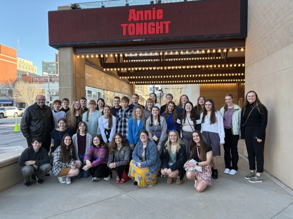 Aquinas Catholic to Annie a group attends a performance at the lied center