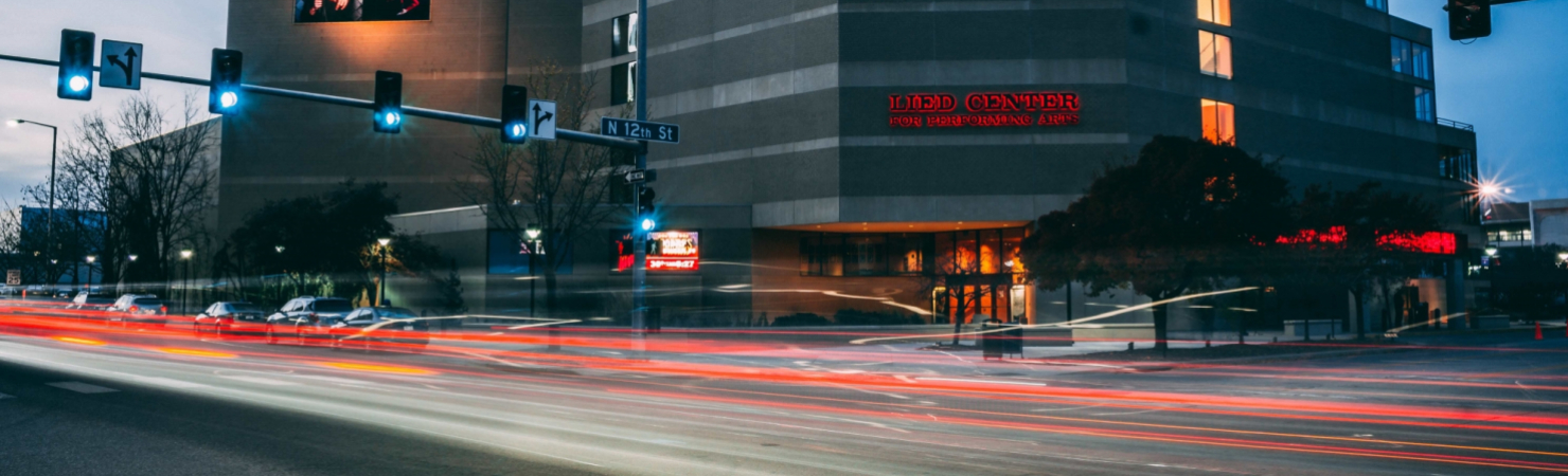 Nighttime Timelapse of traffic going past the Lied Center for performing arts.