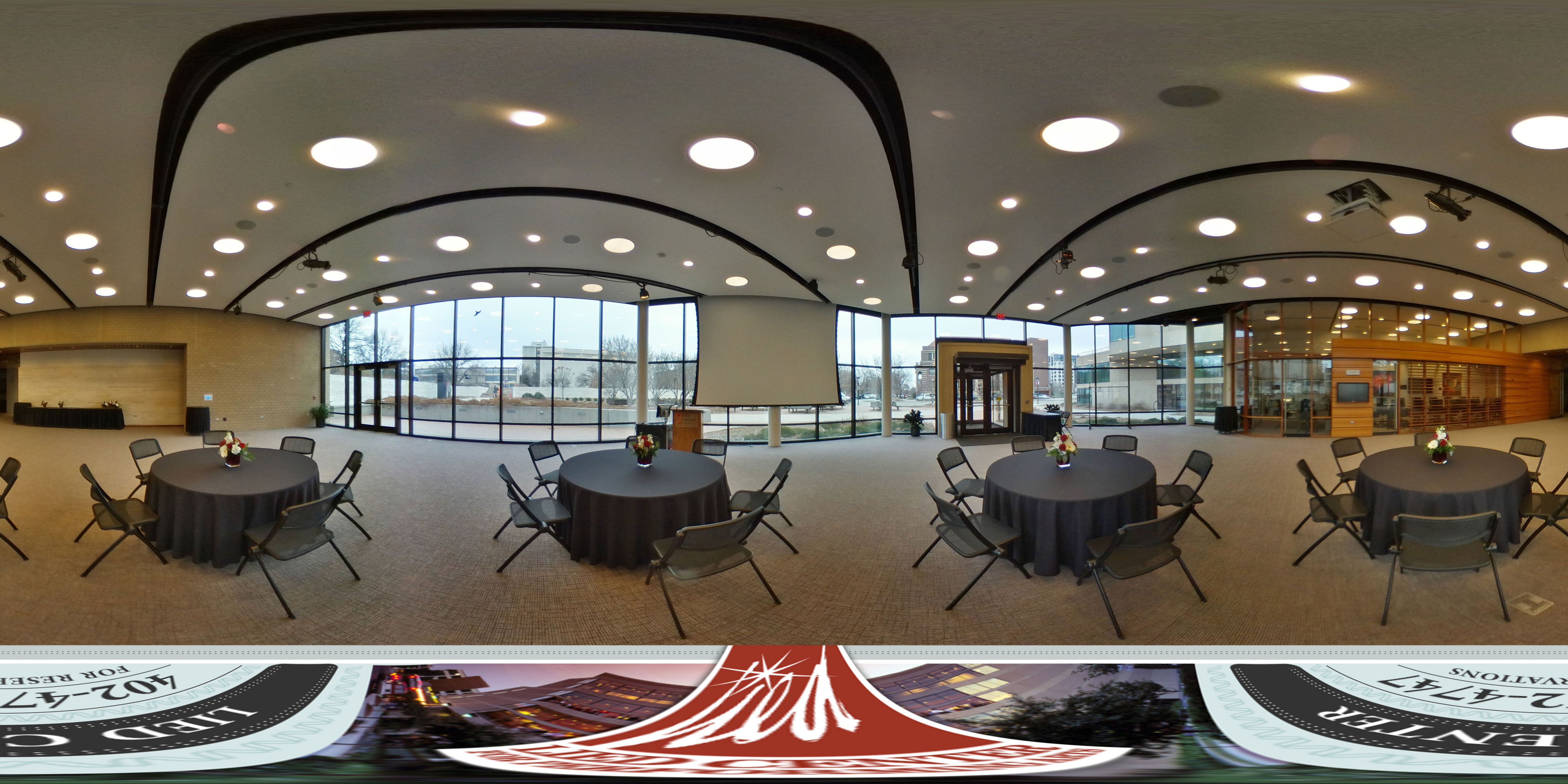 Virtual tour of the Lied Commons showing a banquet setup featuring round tables with black tablecloths and chairs